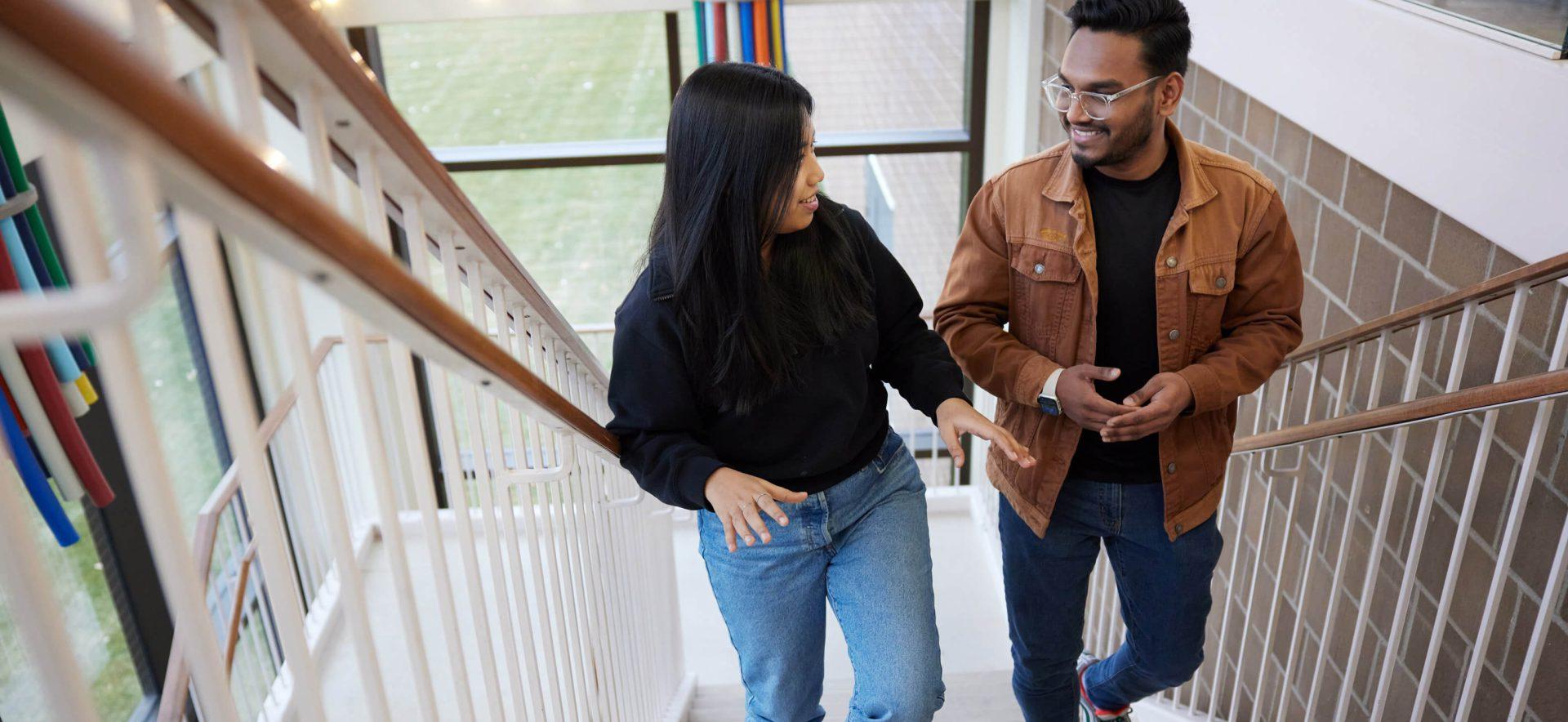 Students walking up the stairs at our campus.